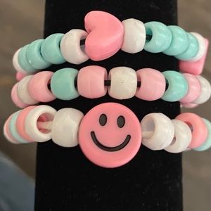 Bracelet set of three, pink and blue themed.